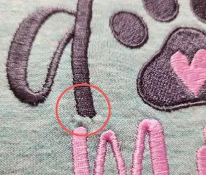 Embroidery puckering on jersey fabric caused by missing or incorrect underlay settings